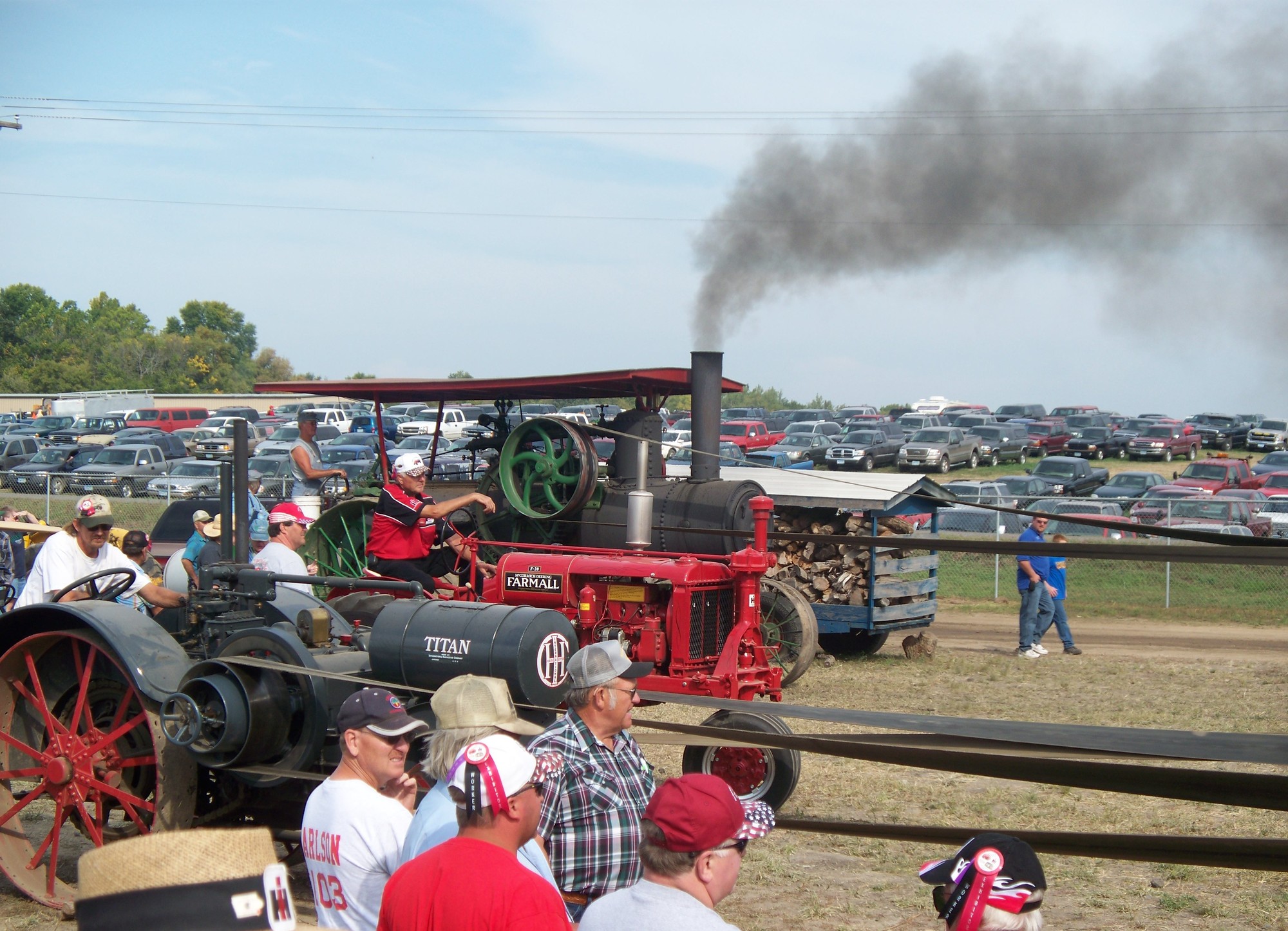 Vintage tractors racing at a fairground