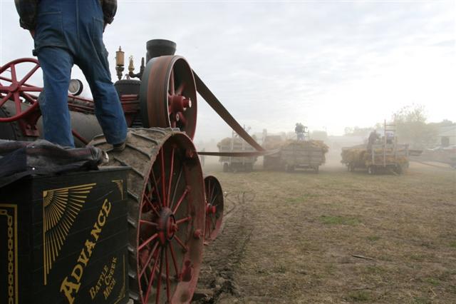 A man standing on a tractor